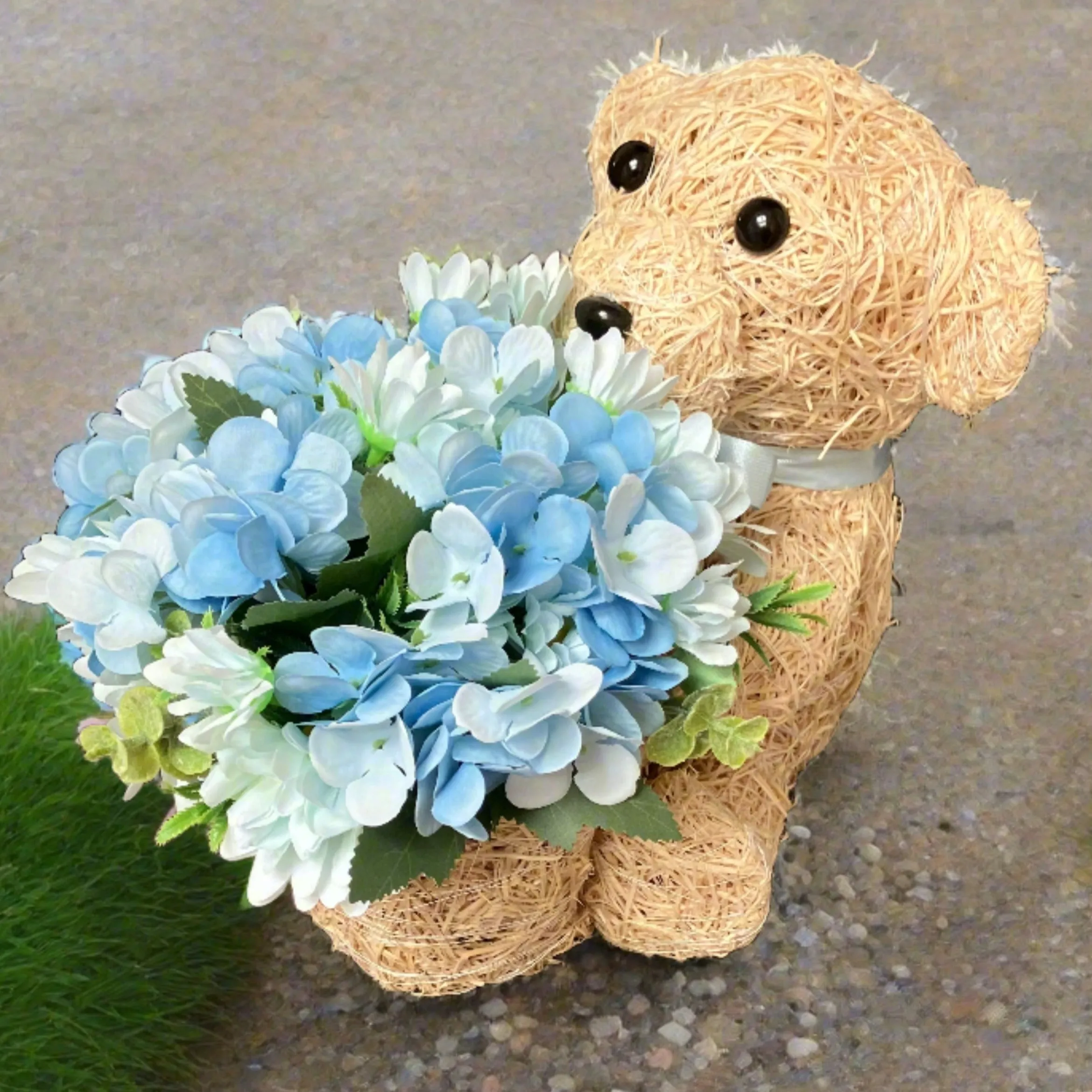 Child graveside memorial teddy with blue or pink flowers