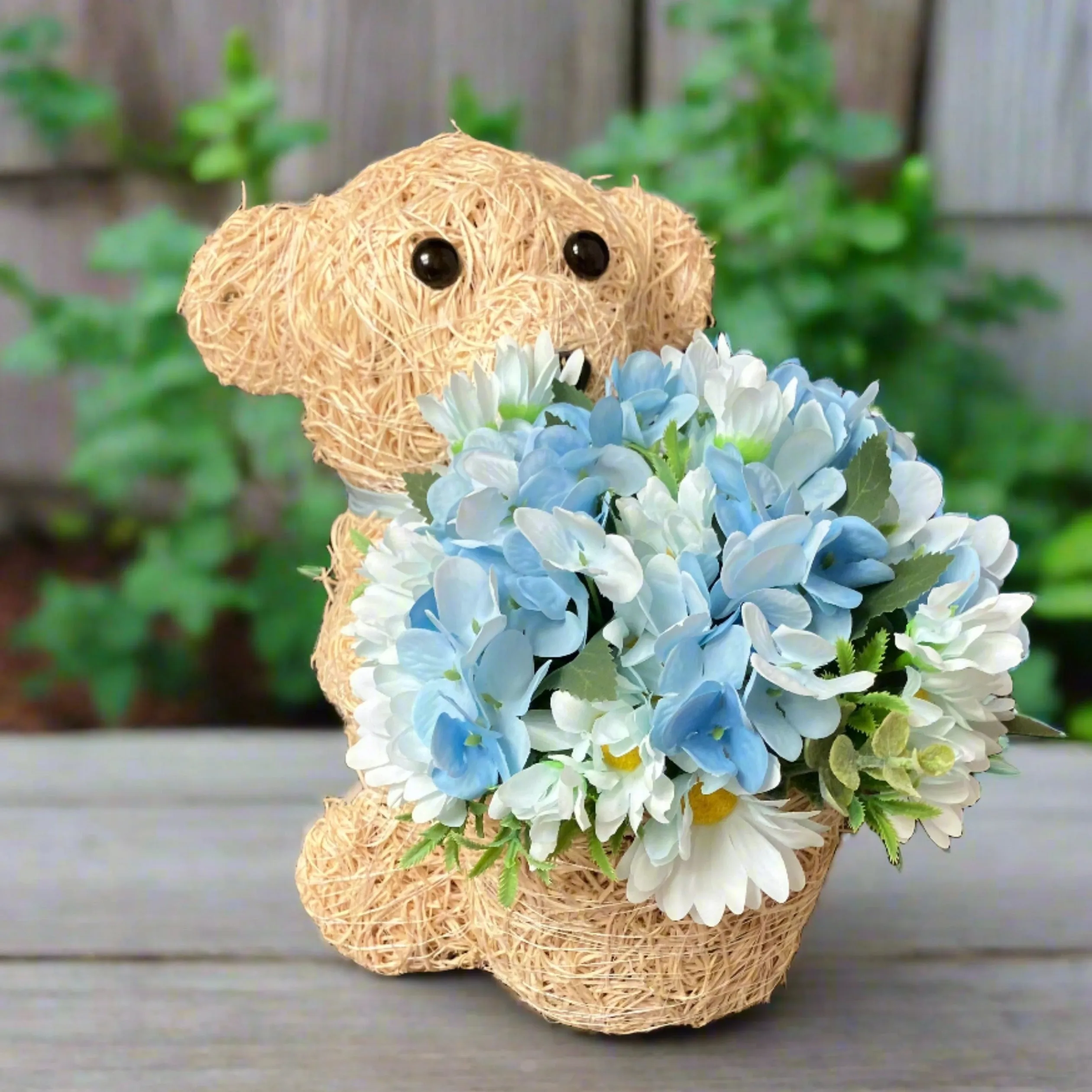 Child graveside memorial teddy with blue or pink flowers